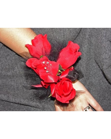 Corsage Of Red Roses And Black Accents