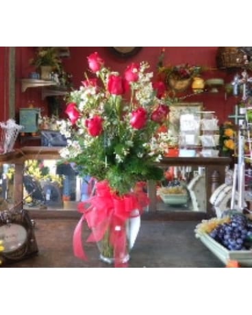 One dozen red rose in  garden vase.