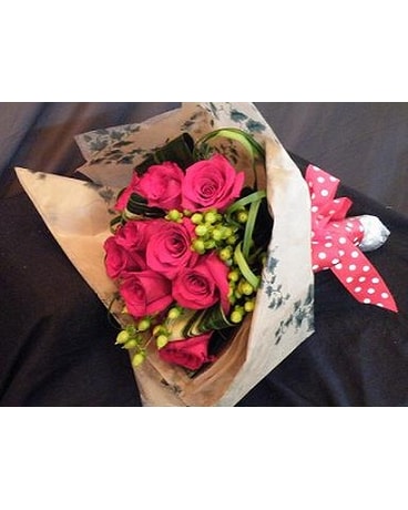1 dozen roses wrapped in paper