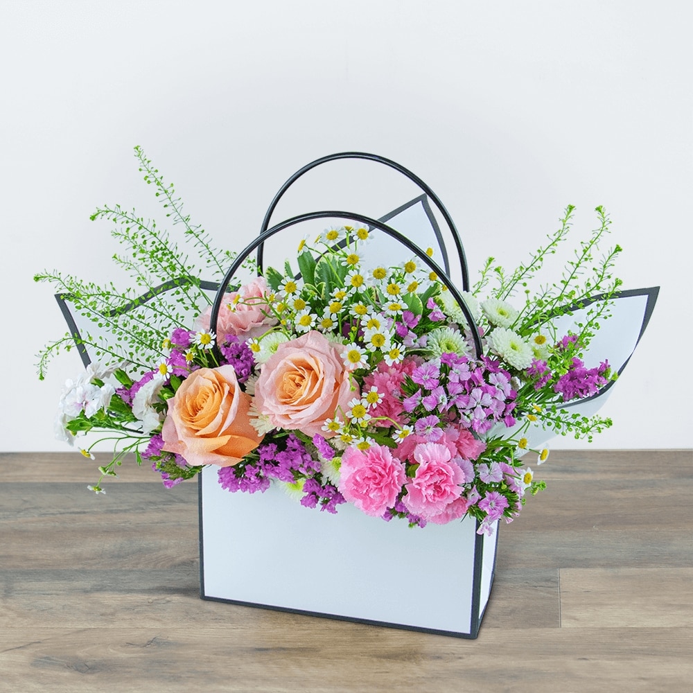 Seasonal Garden Blooming Tote in South Hadley MA - Carey's Flowers