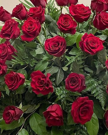 Designer's Choice with Red Roses Included Flower Arrangement