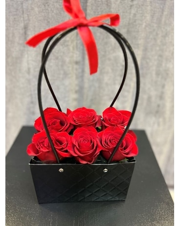 Black Purse with Red Roses Flower Arrangement