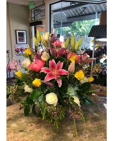 Yellow roses and Stargazers Flower Arrangement