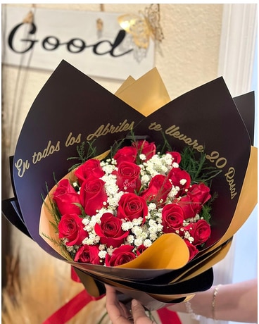 Roses wrapped in black Flower Arrangement