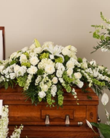 Soft White Casket Spray Flower Arrangement