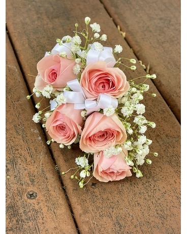 Light pink with filler and white bow corsage in Oak Park IL