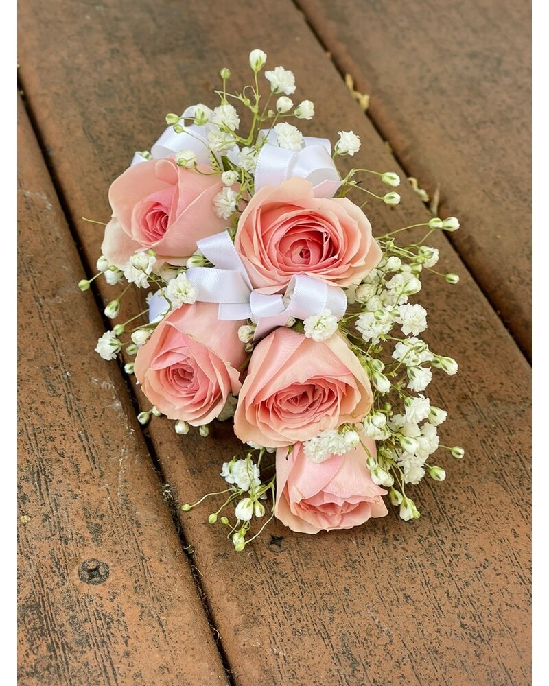what color corsage for light pink dress This blush pink wrist rose corsage is perfect for any soft pink dress