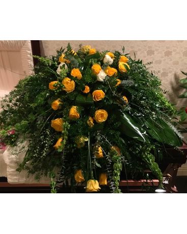 Legacy’s contemporary yellow rose and greens Funeral Casket Spray Flowers