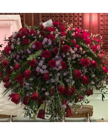 Legacy’s red rose with purple filler Flower Arrangement