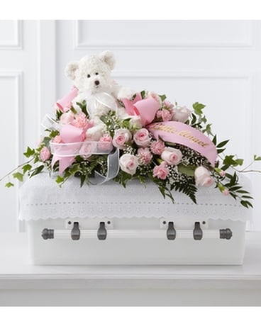 The FTD® Touch of Sympathy™ Casket Spray Flower Arrangement
