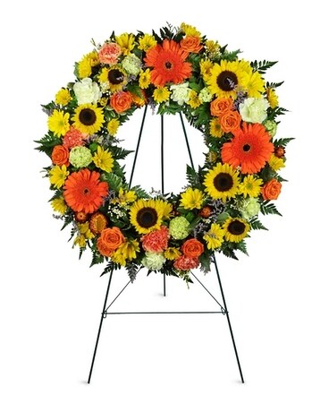 Heavenly Dawn Sunflower Wreath™ Funeral Arrangement