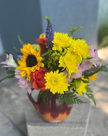 Colorful Flowers in a Pitcher Bouquet