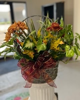 Bow + Dried leaves + Cut Blooms size,  inches height and  inches wide.