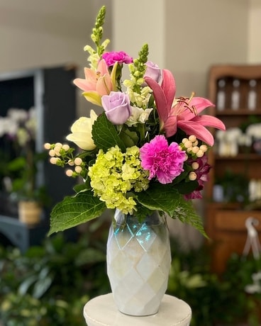 Elegant Blooms in an Iridescent Vase Flower Arrangement