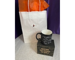 two mugs in a gift bag size,  inches height and  inches wide.