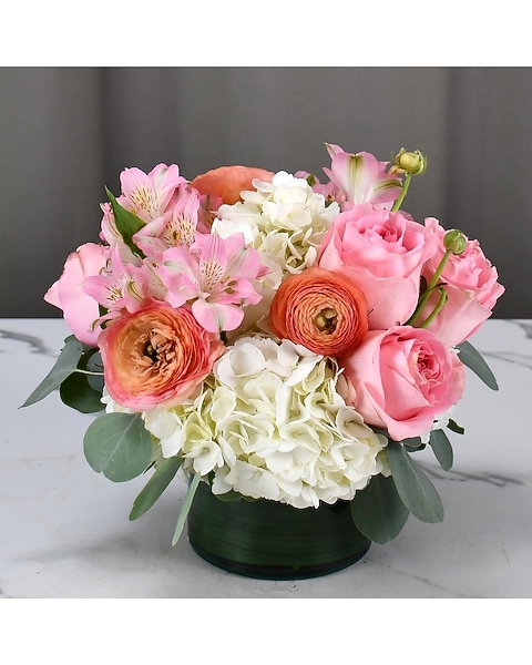 Pastel pink roses, ranunculus, hydrangeas, and alstroemeria