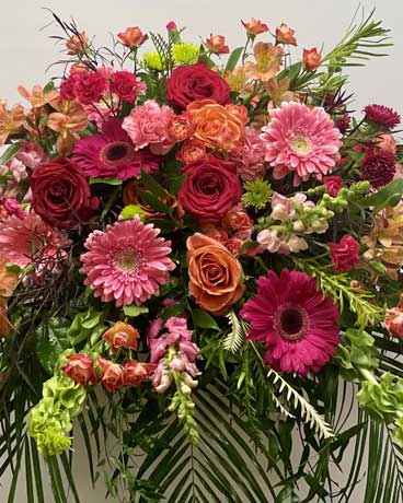 Orange and Pink Casket Spray Flower Arrangement