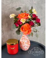 Arrangement & Luxury Candle size,  inches height and  inches wide.