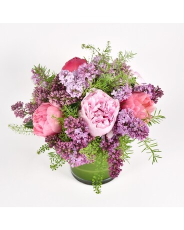 The Lovely Lilac bouquet  is a pink and lavender colored flower arrangement of peonies and lilacs available for flower delivery in NYC from your local NYC florist.