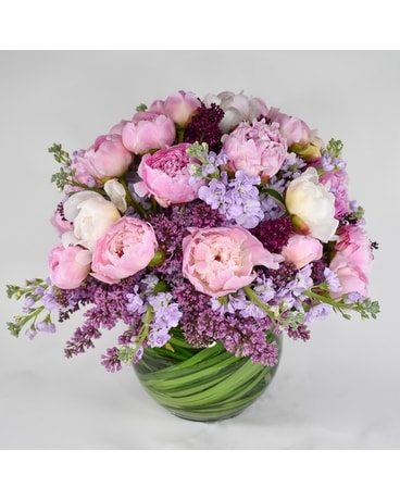 The King of Flowers is a pink, white and purple floral arrangement of peonies and lilacs available for flower delivery in New York City from your local NYC florist.