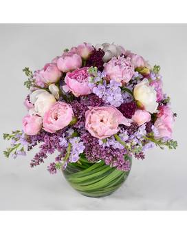 The King of Flowers is a pink, white and purple floral arrangement of peonies and lilacs available for flower delivery in New York City from your local NYC florist.