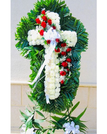 The Divine White Cross with Red Roses Flower Arrangement