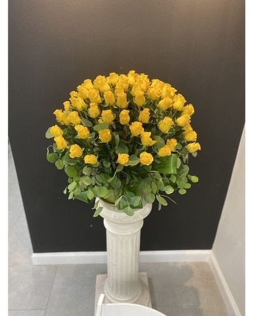 Lady in Yellow Flower Arrangement