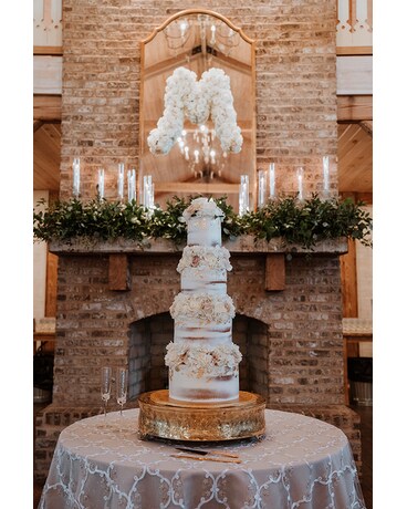 Mantle, Mirror & Cake Flowers Wedding Arrangement