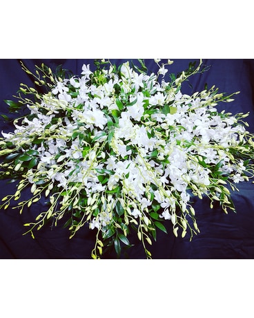 Elegant All Orchid Casket Spray size,  inches height and  inches wide.