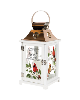 Displayed with silk ivy and bow size,  inches height and  inches wide.