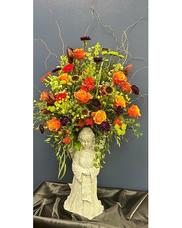 Statue with Fresh Flowers Flower Arrangement