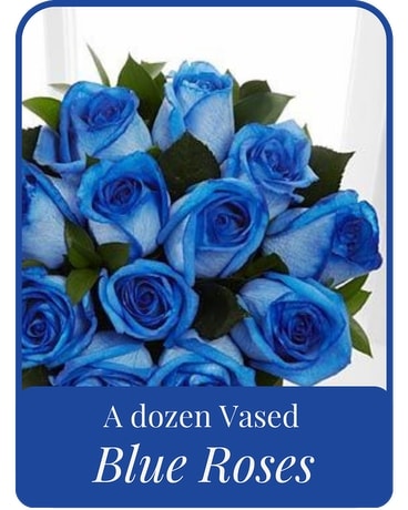 A Dozen Vased Blue Roses Flower Arrangement