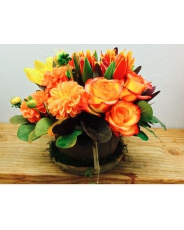 Burst Of Orange Tulip Roses And Orchids Flower Arrangement
