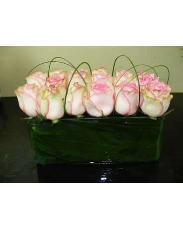 Pink Roses in a Row Flower Arrangement