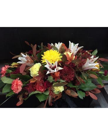 Fall centrepiece with stargazer lilies Flower Arrangement