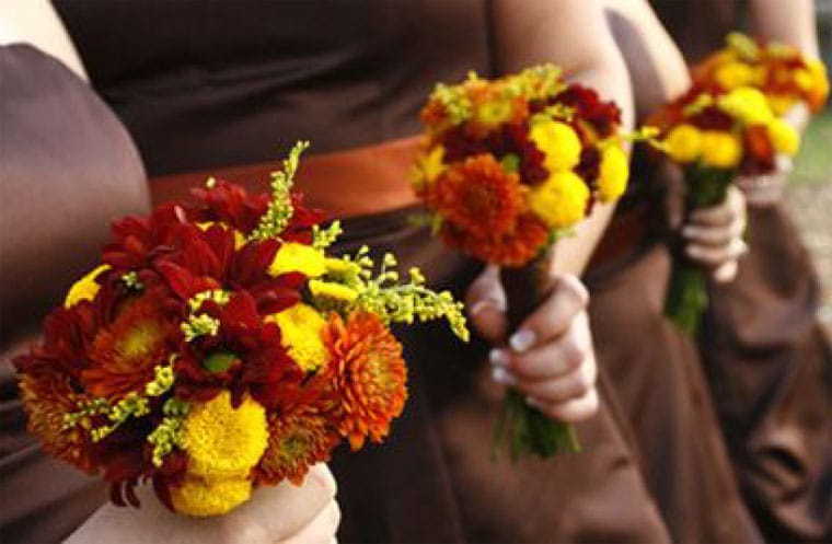 Bridesmaids with Red, Orange and Yellow Bridesmaids Bouquets