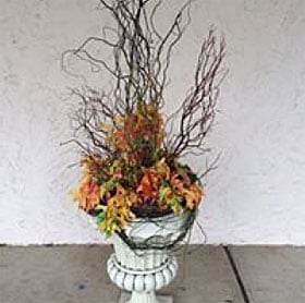Rustic fall urn dried flower arrangement