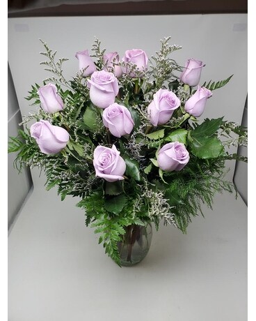 Dozen Lavender Roses in Vase with accent flowers Flower Arrangement