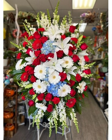 Large Standing spray in red , white and blue Funeral Arrangement