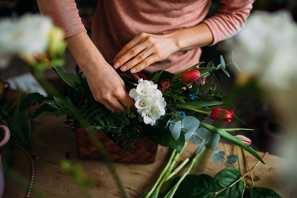 lady arranging a flower