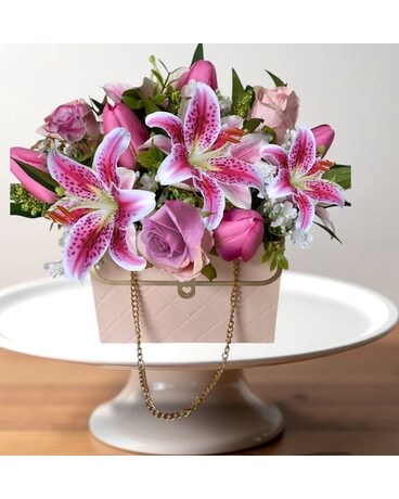 Pink purse With metal chain Flower Arrangement