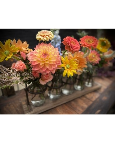 Rustic Bottle Collection Flower Arrangement