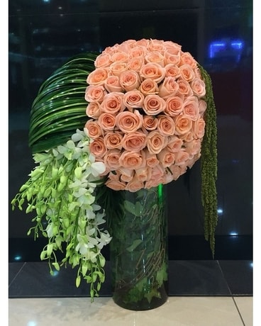 Round Up Some Peachy Roses & Orchids Flower Arrangement
