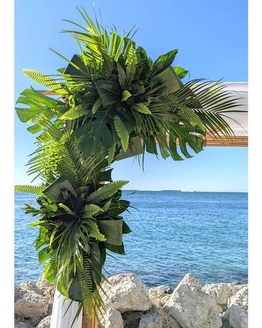 Arch with tropical greenery Wedding Arrangement