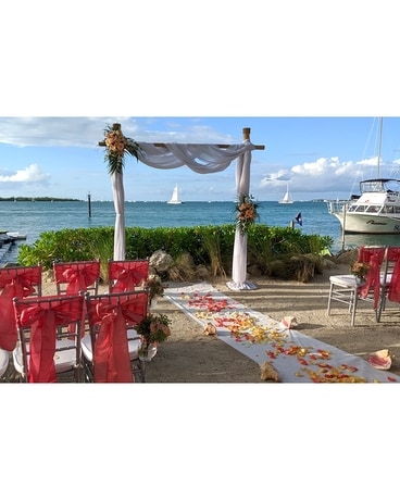 Peach and coral ceremony Wedding Arrangement