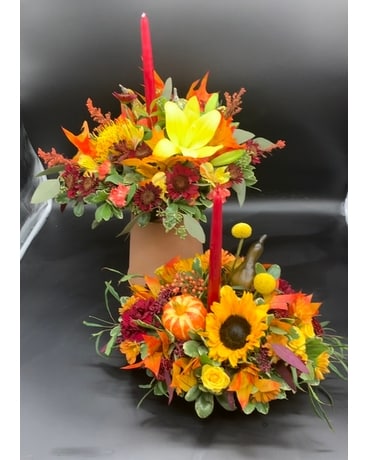 Designers choice single candle centerpiece Flower Arrangement
