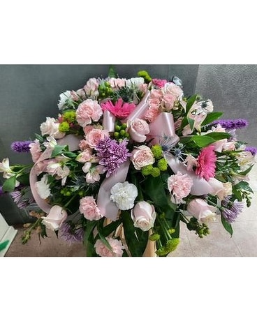 Colors of Spring Casket Funeral Arrangement