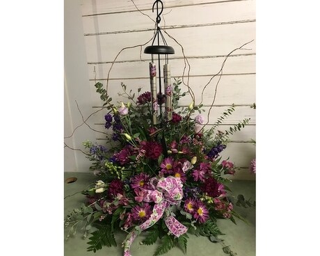 Purple arrangement with chime and stand Flower Arrangement