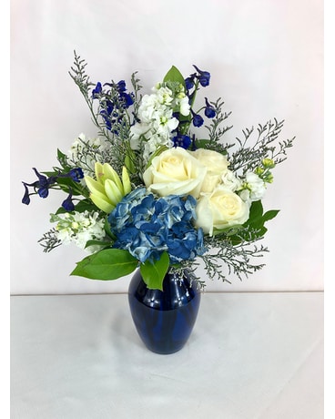 blue hydrangea and white rose boutonniere