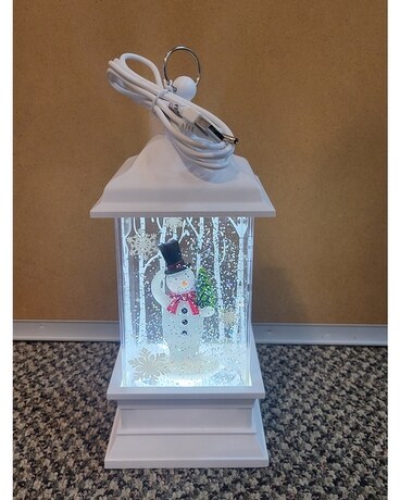 White lantern with snowman holding a tree Gifts
